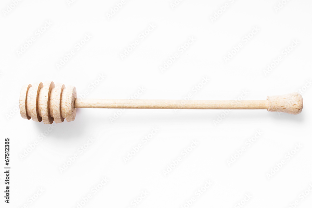 Wooden stick to honey on white background Wooden stick to honey on white background