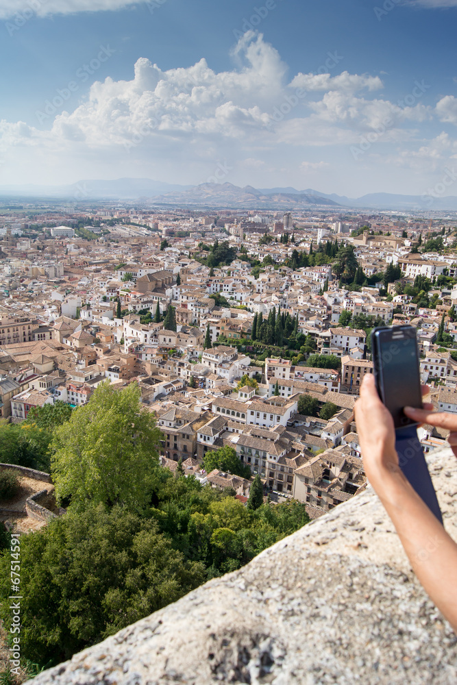 Photographing phone view of Granada from the Alhambra