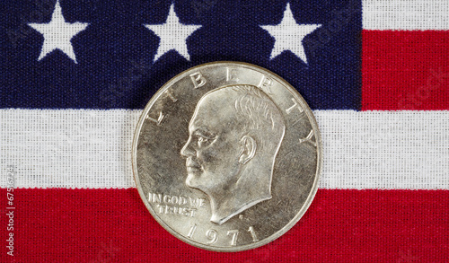 Eisenhower Silver Dollar on American Flag photo