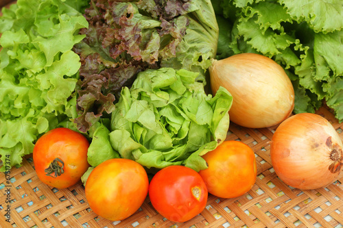Vegetables salad and tomato in the basket