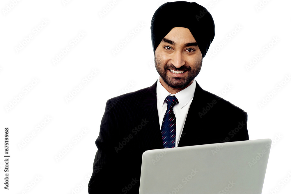 Happy businessman using is laptop computer Happy businessman using is laptop computer