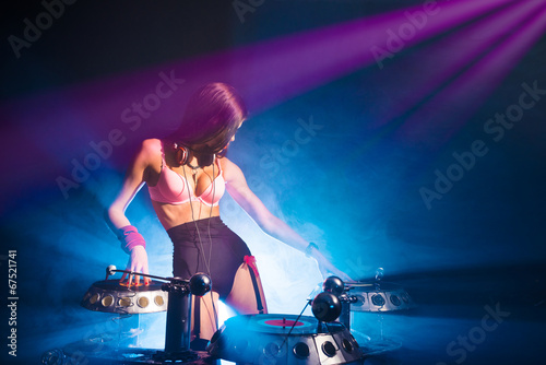 DJ brunette on a blue background