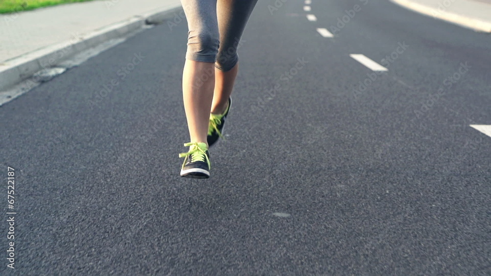 Woman jogging in the city, super slow motion, shot at 240fps Woman jogging in the city, super slow motion, shot at 240fps
