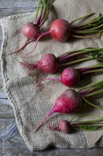 raw fresh red turnips on rustic background