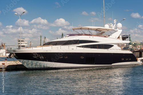 Luxury yacht anchored in the port © dechevm