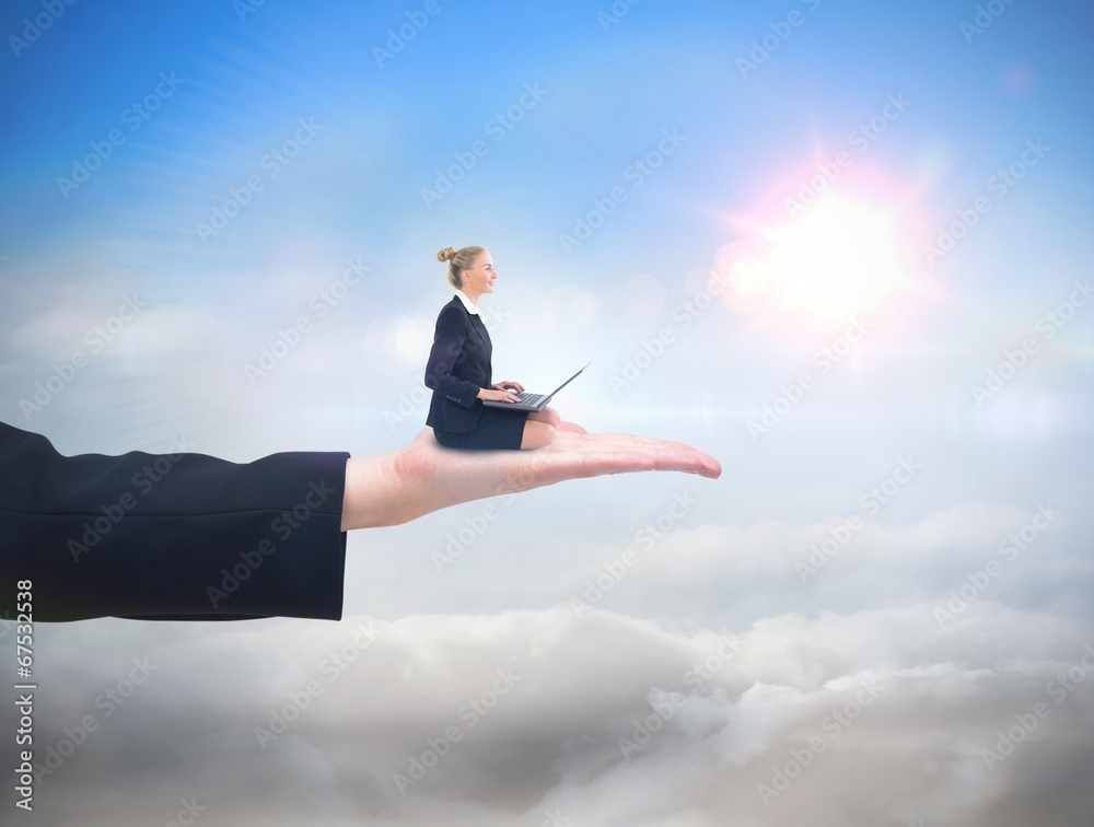 Composite image of businesswoman using laptop Composite image of businesswoman using laptop