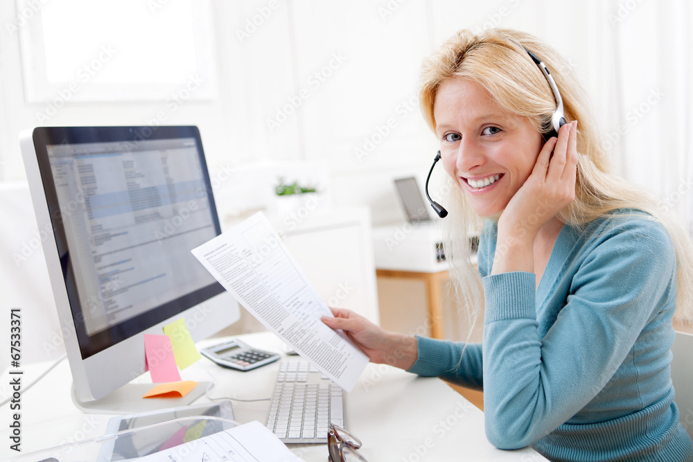 Young attractive blonde working in a call center Young attractive blonde working in a call center