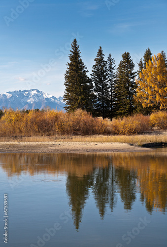 Autumn landscape with reflection in the river