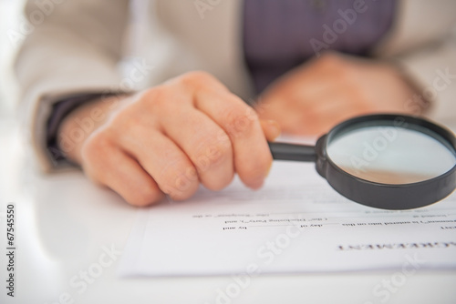 Closeup on business woman exploring document