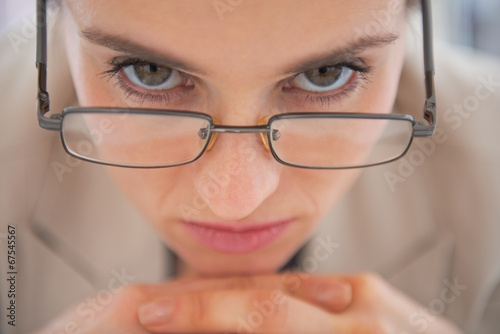 Closeup on business woman wearing eyeglasses