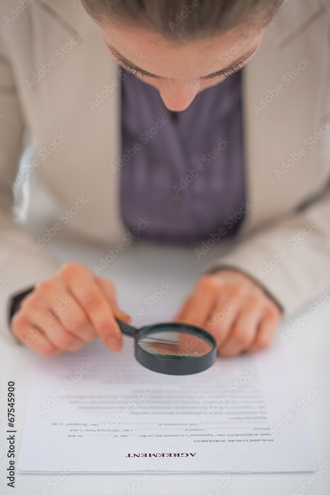 Closeup on business woman exploring document Closeup on business woman exploring document