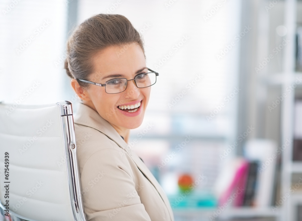 Portrait of happy business woman wearing eyeglasses at work Portrait of happy business woman wearing eyeglasses at work