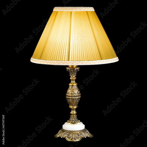 Ornamental vintage table lamp isolated on black with clipping pa