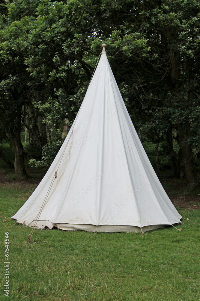 A Traditional White Canvas Bell Shaped Camping Tent.