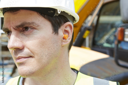 Canvas Print Construction Worker Wearing Protective Ear Plugs