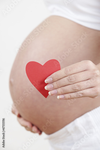 Wallpaper Mural Close Up Of Pregnant Woman Holding Heart Shape Torontodigital.ca