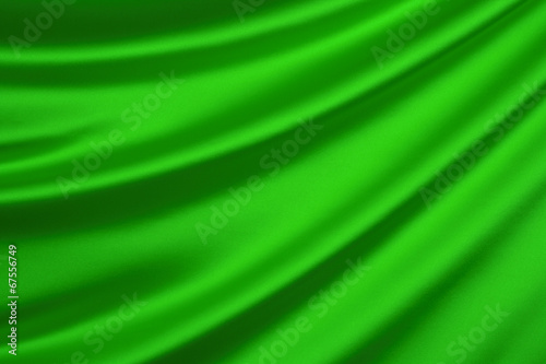 Green silk textile background with copy space