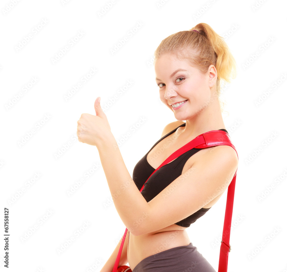 Sport. Fitness sporty girl with gym bag showing thumb up