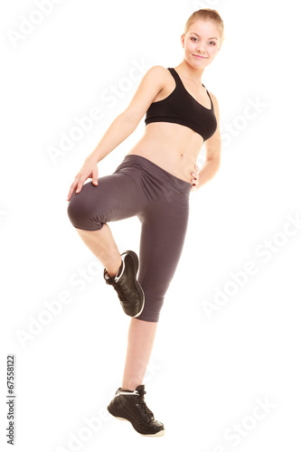 sport. fitness sporty blonde girl stretching leg isolated © Voyagerix