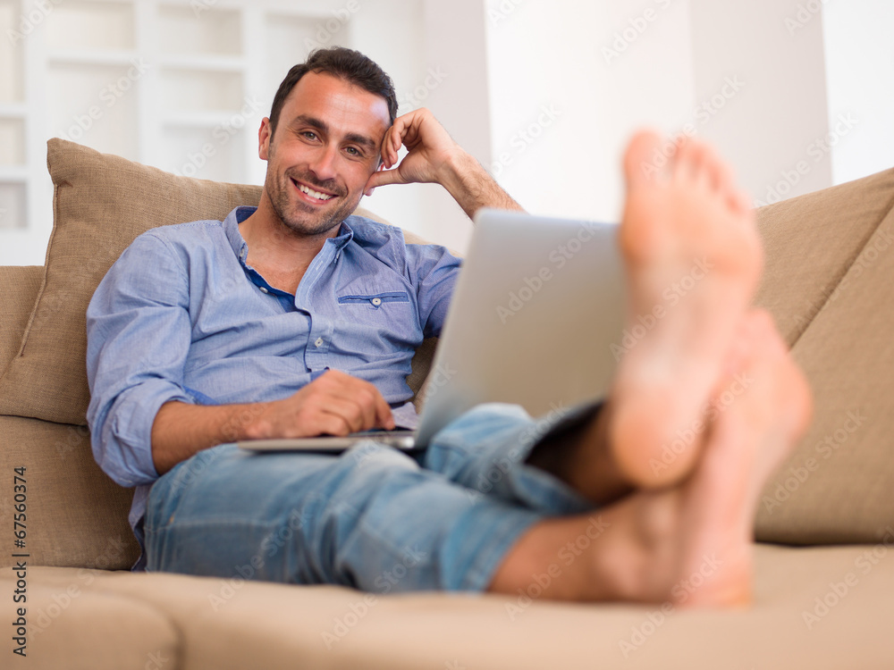 relaxed young man at home on balcony relaxed young man at home on balcony