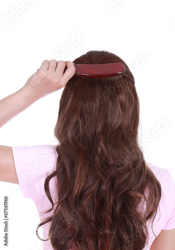 woman brushing her hair