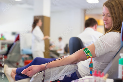 Nurse and blood donor at donation. photo