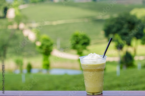 Ice green tea smoothies on tea plantation blackguard