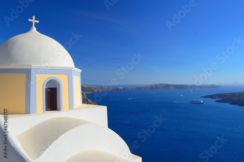 Beautiful church on the caldera and ships in the bay, Fira, Sant
