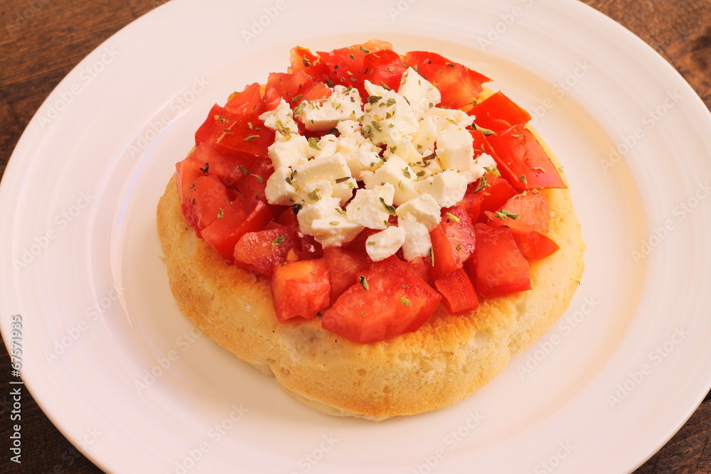 Bruschetta with tomatoes, oregano and feta cheese Bruschetta with tomatoes, oregano and feta cheese