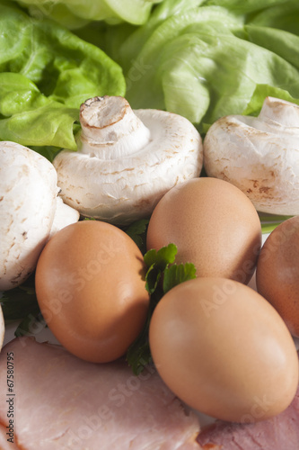 Fresh eggs, mushrooms, ham and lettuce. Fresh ingredients.