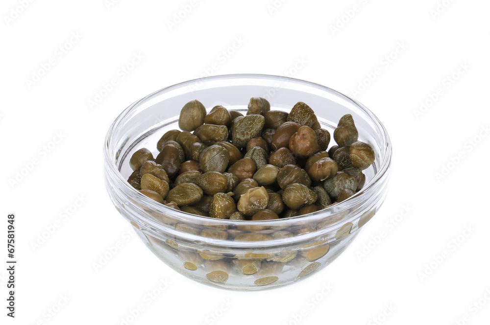 Green capers in a glass bowl. Green capers in a glass bowl.