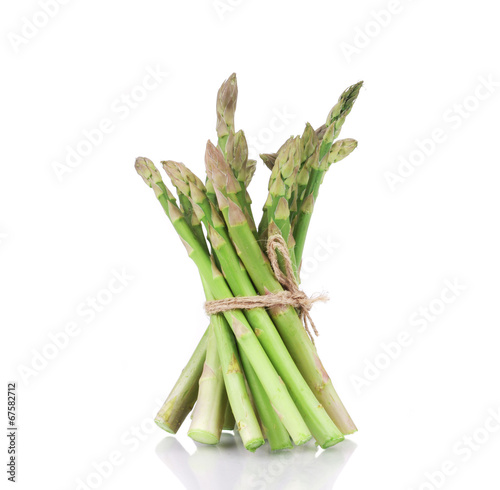 Asparagus tied on the white background.