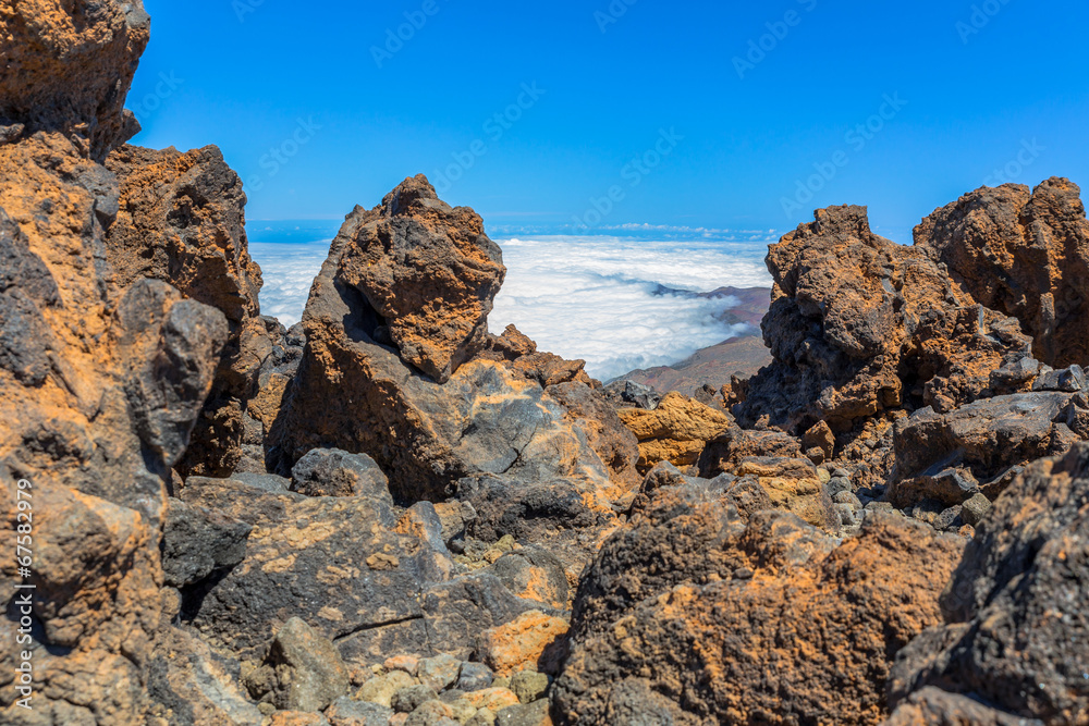 Fog bank in a valley behind volvanic rocks from Teide volcano