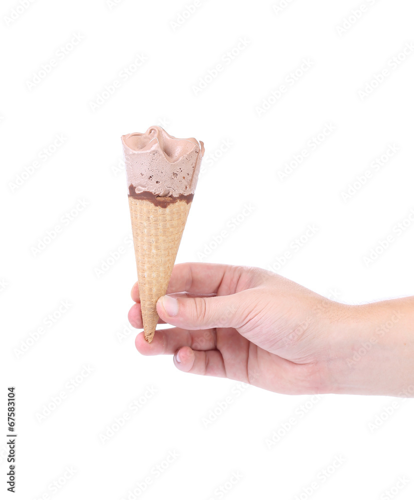 Hand holds ice cream cone. Hand holds ice cream cone.