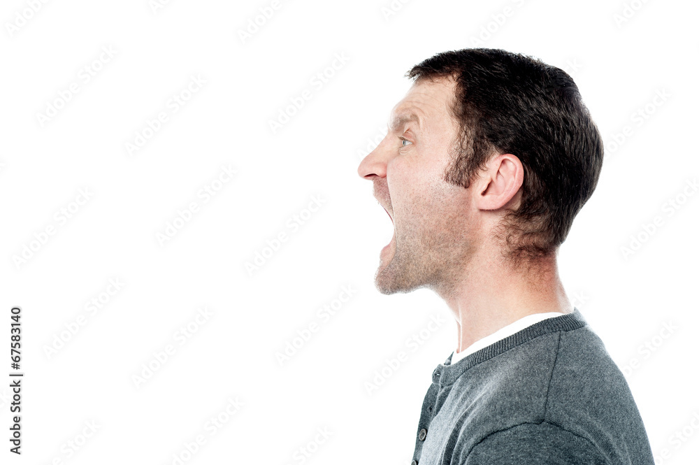 Fototapeta premium Angry young man screaming