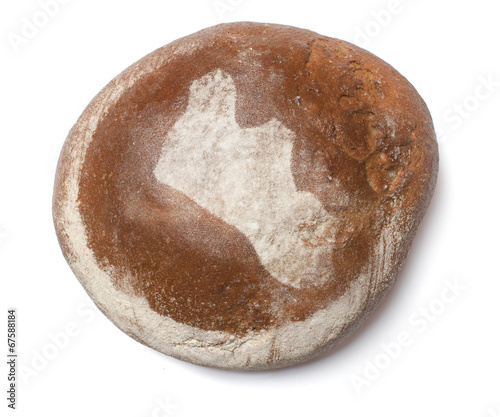 A loaf of fresh bread covered with rye flour in the shape of Lib