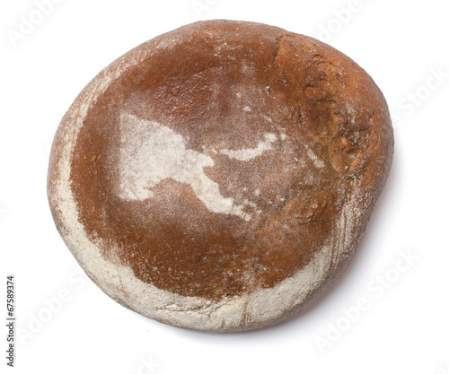 A loaf of fresh bread covered with rye flour in the shape of Pap