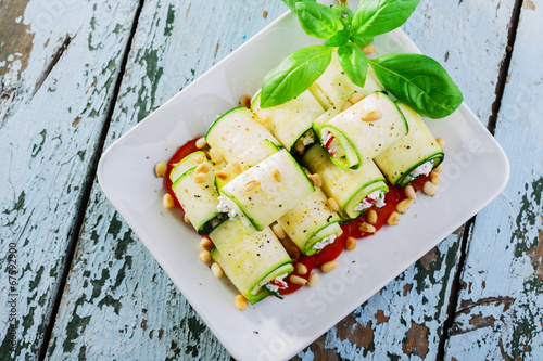 zucchini rolls with feta cheese and pine nuts