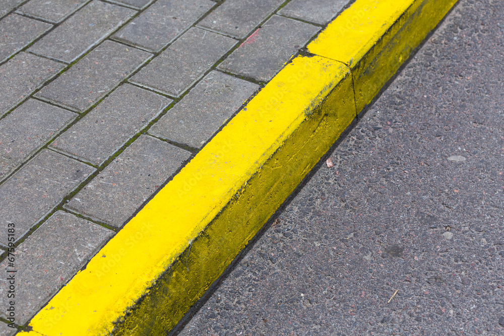 Fototapeta premium Yellow curb line on the road