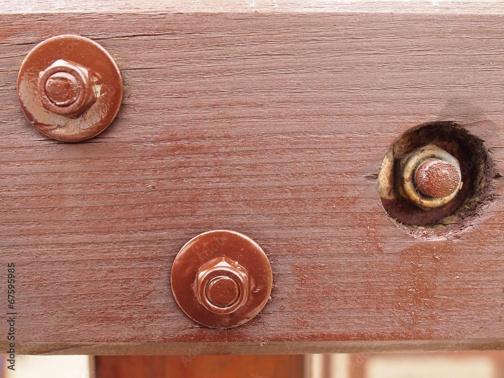Screw joint point of brown wooden construction. Detail of screw Screw joint point of brown wooden construction. Detail of screw
