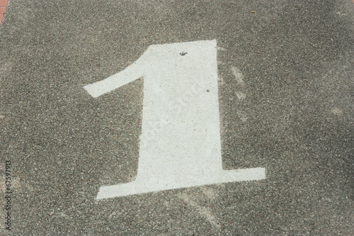 Number one sign on ground