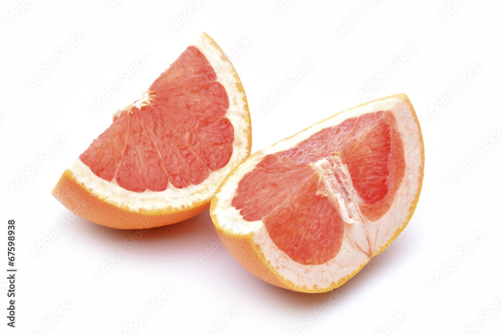 Slices of grapefruit on a white background. Slices of grapefruit on a white background.