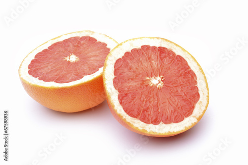 Slices of grapefruit on a white background.