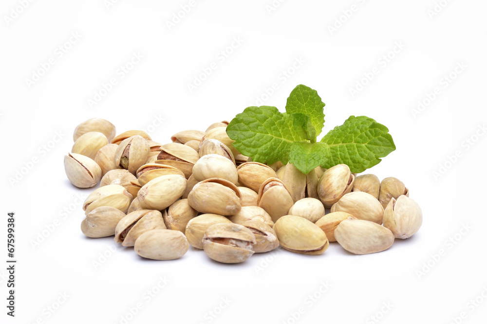 Heap of pistachios on the white background Heap of pistachios on the white background