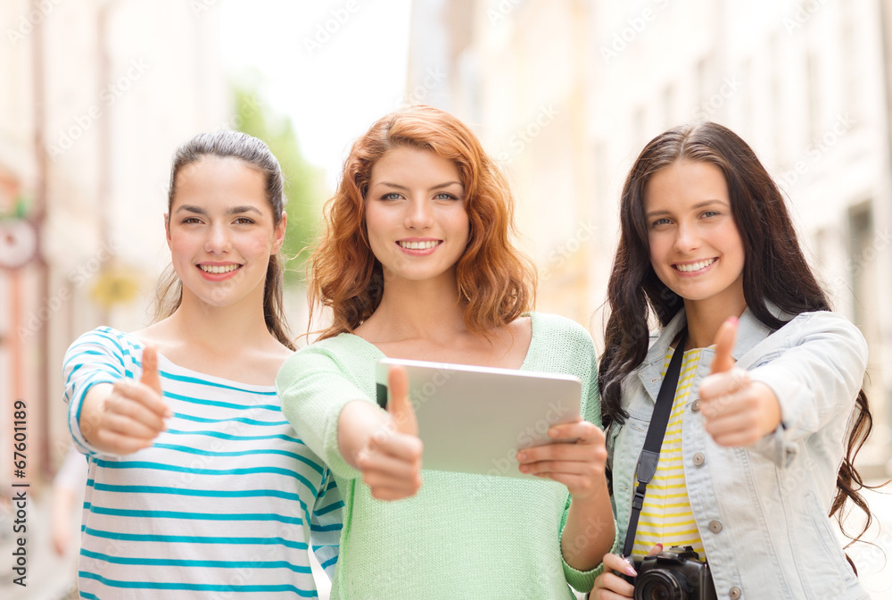 smiling teenage girls with tablet pc and camera smiling teenage girls with tablet pc and camera