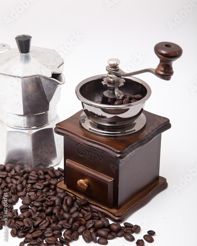 Isolated coffee bean grinder and moka pot
