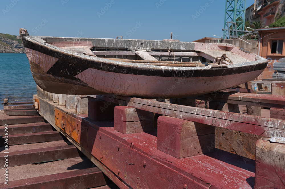 Old fishing boat being repaired at a small shipyard