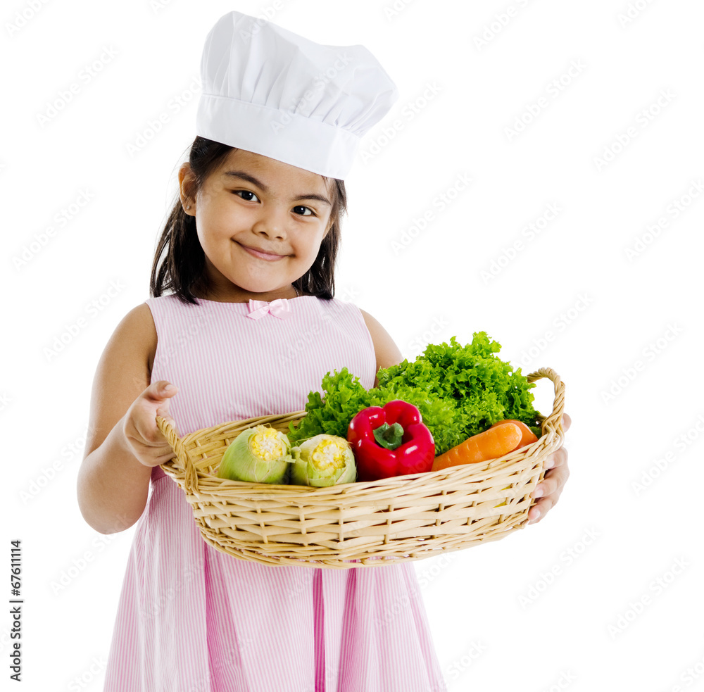 Little indian girl holding a basket of vegetables Little indian girl holding a basket of vegetables