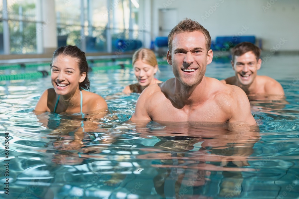 Fitness class using underwater exercise bikes