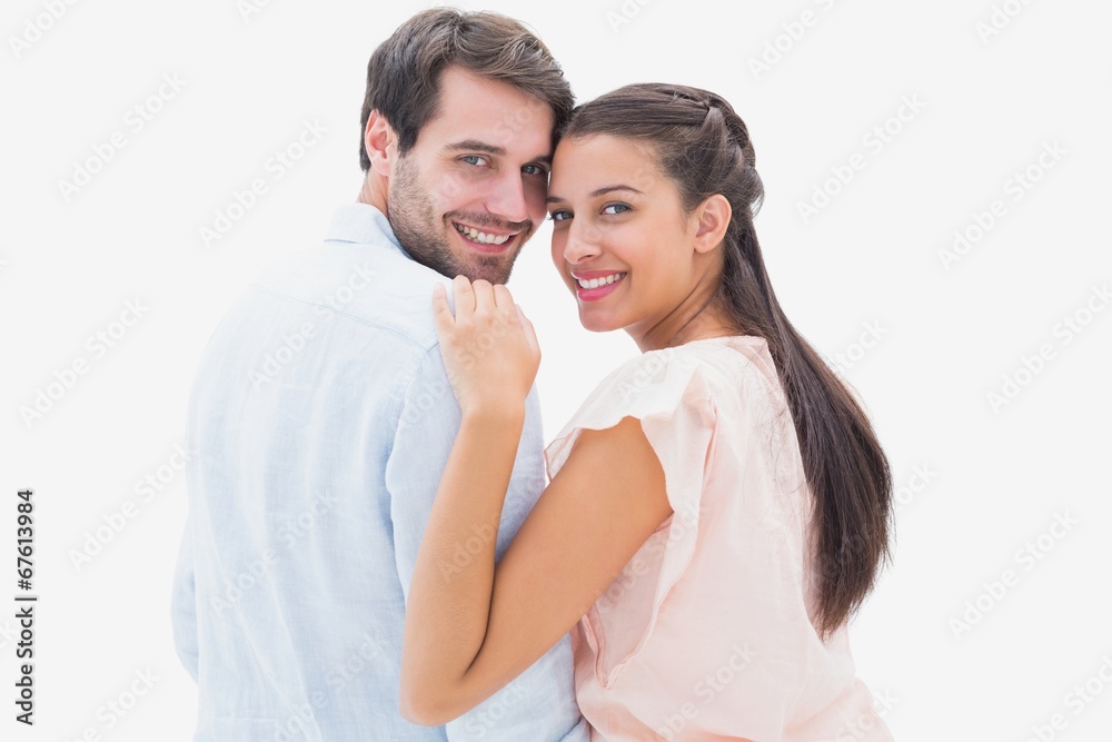 Attractive young couple smiling at camera Attractive young couple smiling at camera